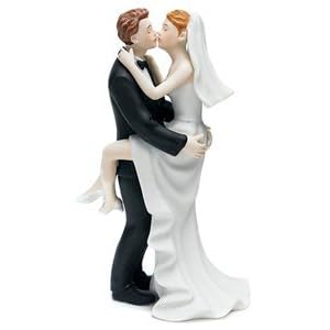 Kissing bride and groom wedding cake topper