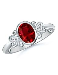 Oval Ruby and Round Diamond Vintage Ring in White Gold