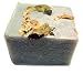 Fragrant lemongrass oil is combined with lime and ylang ylang for a sensuous scent. Poppy seeds exfoliate. Sesame oil and mango butter moisturize. Antique green with jasmine petals on top.