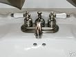 Banner Antique Brass Lav Faucet W/ Porc Lever Handles