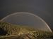 A Rainbow Arches over the Alaska Highway in British Columbia, Canada Photographers Photographic Poster Print by Raymond Gehman, 16x12