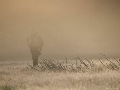 A Man Walks Through the Winter Mist