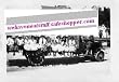 Group of People Sitting on a 1917-1920 Flat Bed Truck