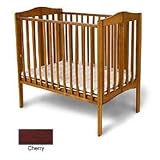 Angel Line Foldable Mini Crib Finish: Cherry