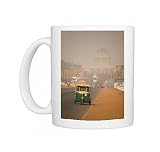 An auto rickshaw drives along the Rajpath, in front of the Rashtrapati Bhavan Photo Mugs