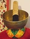 Tibetan Buddhist 'Sacral' Chakra Singing Bowl; Hand Beaten in Nepal - 4.6in diameter playing a tone in the mid range; with Singing Bowl Cushion (Colours may vary from image) and playing stick - Sold by Spiritual Gifts. Usually dispatched within 2 working days.