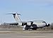 Wallmonkeys Peel and Stick Wall Decals - A C-17 Globemaster Iii Doing an Assault Landing on a New Ru
