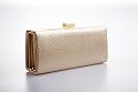 Light gold clutch handbag box style covered in faux snake with shoulder chain