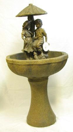 Cute Couple Under an Outdoor Fountain