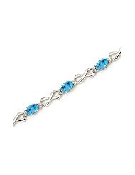 10K White Gold Oval Blue Topaz and Diamond Bracelet by Jewelry Mountain