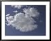 A Deep Blue Sky with Bright Fluffy White Clouds Framed Art Poster Print, 39x31