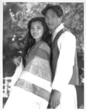 KELLY HU AND JASON SCOTT LEE IN AMERICAN EYES ORIGINAL 7X9 PHOTOGRAPH. BONUS: ORIGINAL PRESS INFO SHEET ATTACHED TO BOTTOM OF PHOTOGRAPH.
