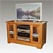 Highland Road Corner TV Stand Finish: Antique, Hardware: Wood