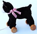 A Pull Along Cat with removable wooden wheels so it doubles up as a
			cuddly soft toy as well. How clever is that?