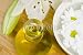 Wallmonkeys Peel and Stick Wall Decals - Body Oil and White Daisies Floating in a Bowl of Water - Removable Graphic