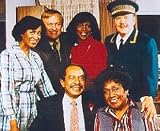 SHERMAN HEMSLEY AS GEORGE JEFFERSON, ISABEL SANFORD AS LOUISE  WEEZY  MILLS JEFFERSON FROM THE JEFFERSONS - Professional WALL POSTER Print - Licensed Photo - Picture SIZE 25x20 (63x51cm)