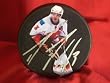 Dion Phaneuf Autographed Calgary Flames Photo Hockey Puck, Proof Photo of Dion Signing for Us.