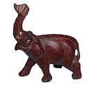 Asian elephant with raised trunk, hand carved from solid wood