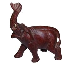 Asian elephant with raised trunk, hand carved from solid wood