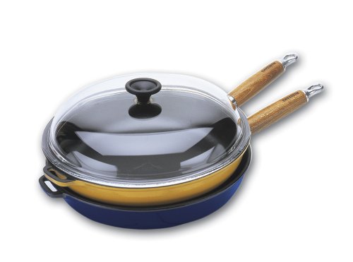 World Cuisine 11 inch diameter cast-iron frying pan with wooden handle. The pan's interior is black with an exterior of red. World Cuisine 11 inch diameter cast-iron frying pan with wooden handle. The pan's interior is black with an exterior of red.