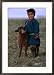 Boy Wearing Traditional Dell Standing Next to Baby Goat, Mongolia Framed Art Poster Print by Jerry Galea, 21x29