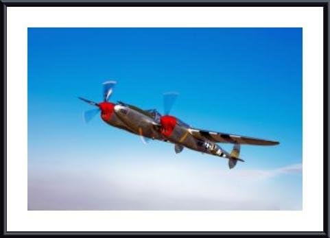 A Lockheed P-38 Lightning fighter aircraft in flight., framed black metal, white matte 20 x 16 Inches.