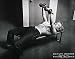 Marilyn Monroe With Weights - Artist: Philippe Halsman - Art Print Poster - With a Black Wood Frame - Image Size: 28.00 by 22.00 inches Art Print Poster - With a Black Wood Frame