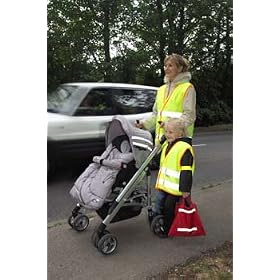 Mother walking safely with child wearing reflective clothing