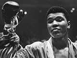 Cassius Clay After Defeating Doug Jones in Close Heavyweight Bout, in Madison Square Garden Artists Premium Photographic Poster Print by George Silk, 18x24