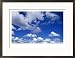 Sunlit Fluffy White Clouds in a Blue Sky Framed Photographic Poster Print by Jason Edwards, 29x21