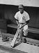Chicago Cub's Ernie Banks, Stooping in the Dug-Out Holding Two Bats Against Cincinnati Reds Collections Premium Photographic Poster Print by John Dominis, 30x40