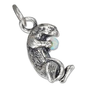 STERLING SILVER SEA OTTER CHARM HOLDING AN OPAL CHIP
