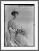 Newswire Photo (XL): Miss Ceceilia Fox in wedding dress (?) with bouquet. Lallie Charles, Photo. / Lallie Cha