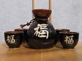 Japanese black sake set with good luck text and four cups