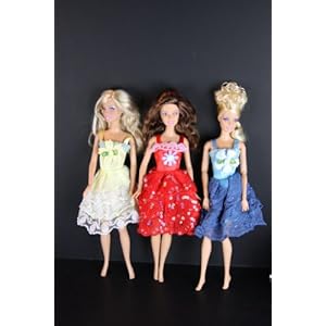 A Set of 3 Cocktail Length Gowns Made for the Barbie Doll A Set of 3 Cocktail Length Gowns Made for the Barbie Doll