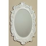 Distressed white oval mirror with handcarved details