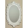 Distressed white oval mirror with handcarved details