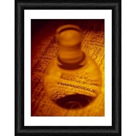 Framed 16x12 Print (40x30cm) Pharmaceutical flask on a newspaper finance page by Science Photo Library