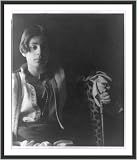 Historic Print (S): [Kahlil Gibran in Middle Eastern(?) costume with leopard skin and staff, seated]