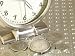 American Coins Beside Stainless Steel Clock Education Photographic Poster Print, 32x2...