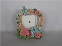 Valentine's picture frame in a heart shape with flowers.
