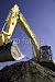 Wallmonkeys Peel and Stick Wall Decals - Yellow Excavator Working Soil on Construction with Deep Blu