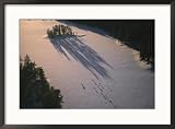 A Classic Adirondack Chair is Silhouetted by a Lake in New York Home & Hearth Framed Photographic Poster Print by Stacy Gold, 29x21