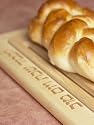 Loaf of Challah on Wooden Board with Hebrew Characters Photographic Poster Print, 12x16