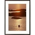 Rowboat heads toward a series of low-lying islands at twilight Subject Framed Art Poster Print by Thomas J. Abercrombie, 21x29