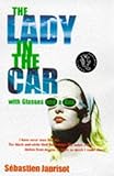 The lady in the car with glasses and a gun