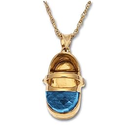 Commemorate baby's birth with this adorable gemstone baby shoe pendant. Fashioned from polished 10 karat yellow gold, it has a sweet baby shoe shape with a half-moon of vibrant Swiss blue topaz at the toe. A petite diamond accent on the side buckle (.009 ct, J, I2) adds a dash of luxe. The pendant dangles from a tapered gold bale and is showcased on an 18-inch yellow gold rope chain.