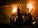 Flames engulf a house during a forest fire Photographic Poster Print by Mark Thiessen...