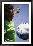Girl Standing in a Goal Looking at a Soccer Ball Framed Photographic Poster Print, 33x45