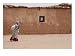 A Refugee from Western Sahara Leaves a Red Cross Food Distribution Center Photographic Poster Print by Steve Raymer, 40x30